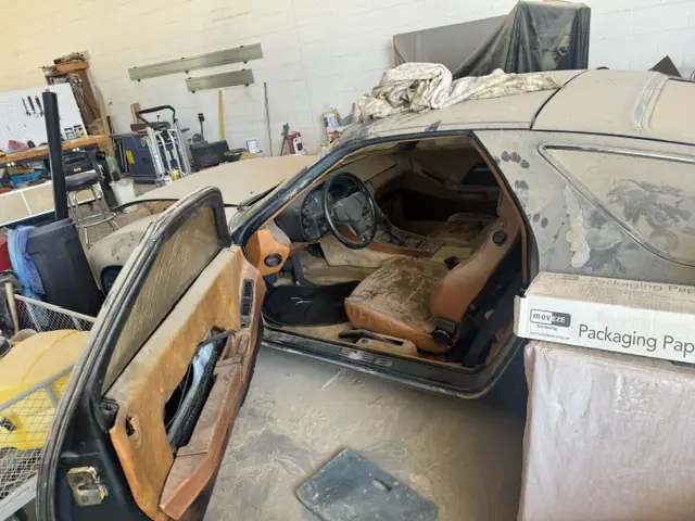 Driver's door open on the original interior (Aug 1, 2026: on the car)