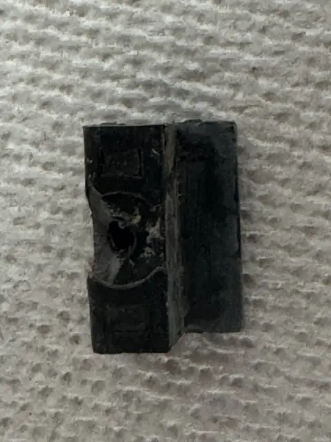 Weathered rubber seal with old adhesive